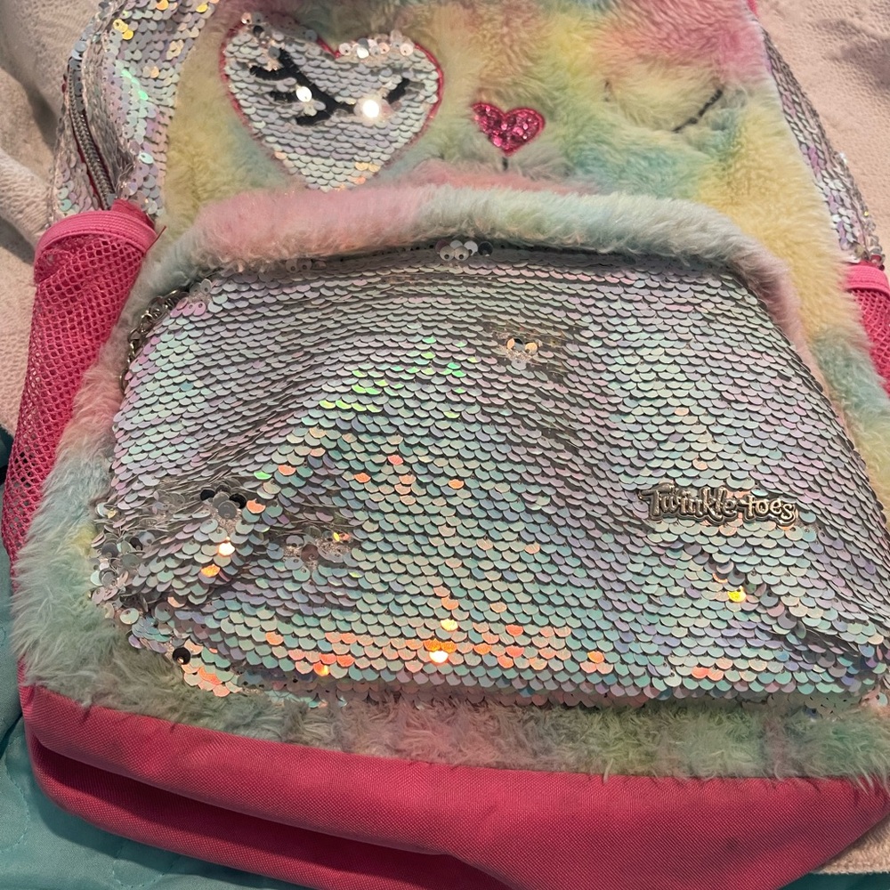 Twinkle Toes Sequin Multi Color Girl’s Backpack Has minor stains on bottom.